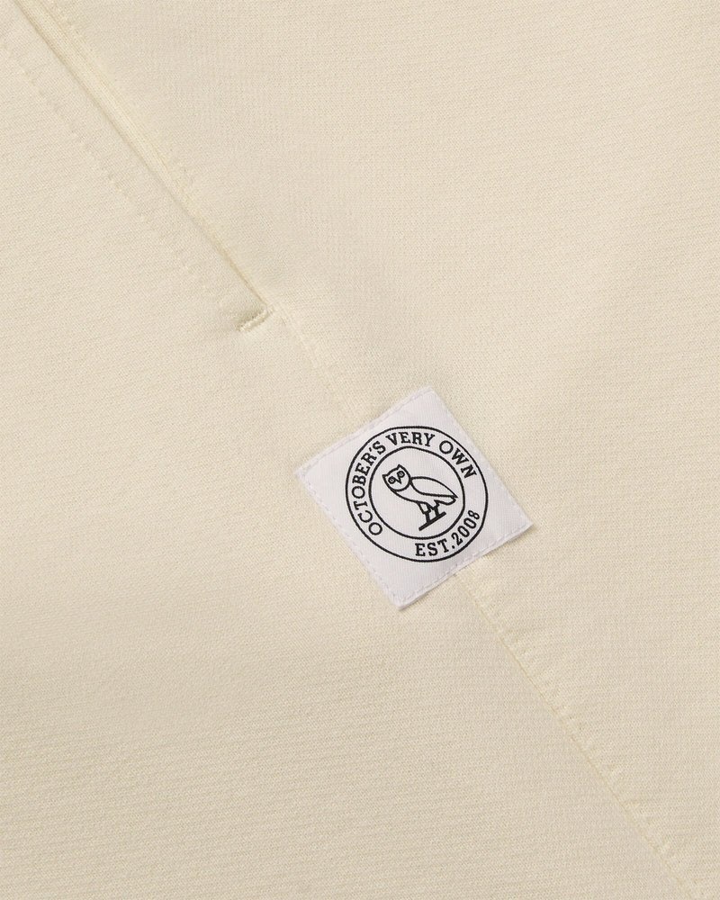 pantalon de survêtement crème ovo french terry à ourlet ouvert collection octobre
