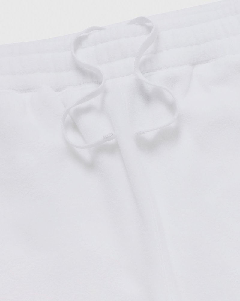 pantalon de survêtement blanc à ourlet ouvert et logo ovo arch collection octobre.