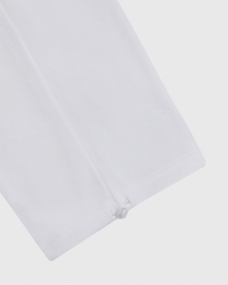 pantalon de survêtement blanc à ourlet ouvert et logo ovo arch collection octobre.