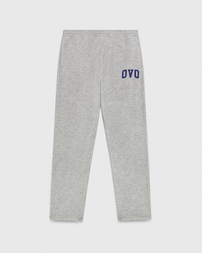 pantalon de survêtement gris à ourlet ouvert et logo ovo arch collection octobre.