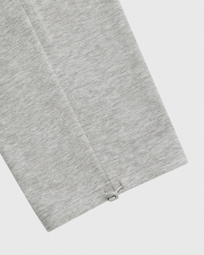 pantalon de survêtement gris à ourlet ouvert et logo ovo arch collection octobre.